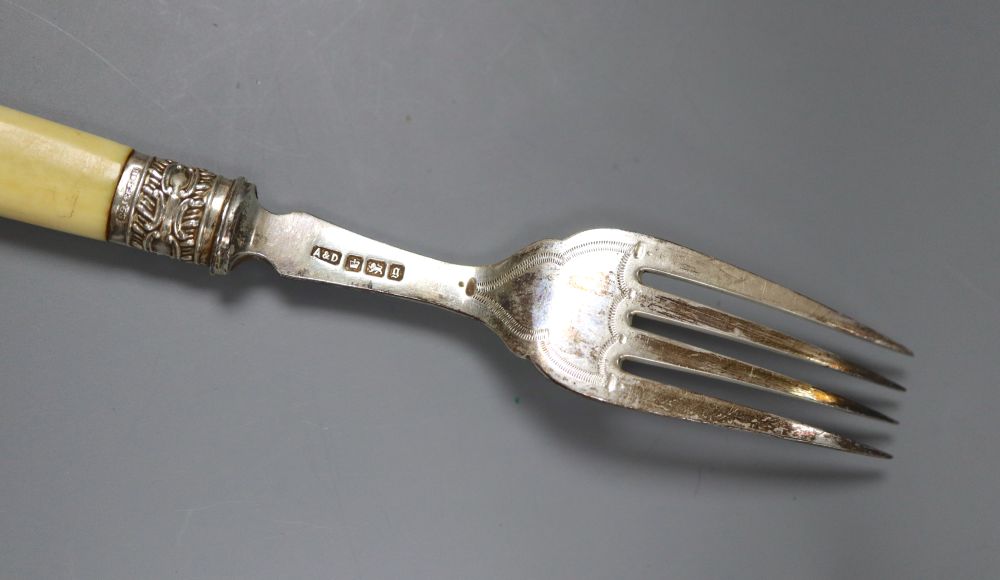 A pair of Edwardian silver ivory handled fish servers by Mappin & Webb, six pairs of ivory handled silver dessert eaters, etc.